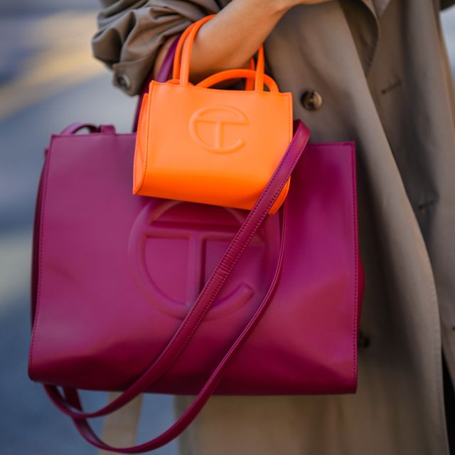 a person carrying a pink purse