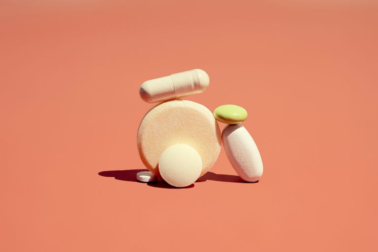 a group of pharmaceutical drugs pills laid in a pile
