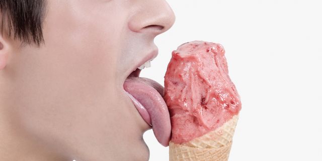 Close-up of a man licking an ice cream