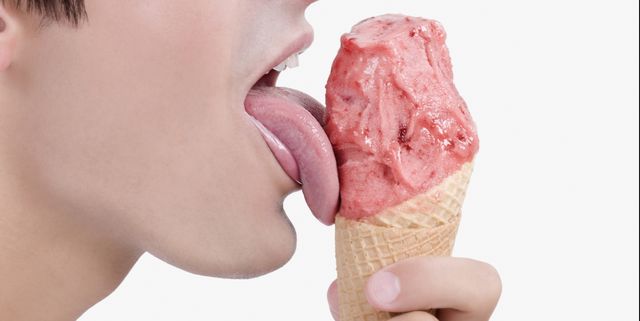 Close-up of a man licking an ice cream