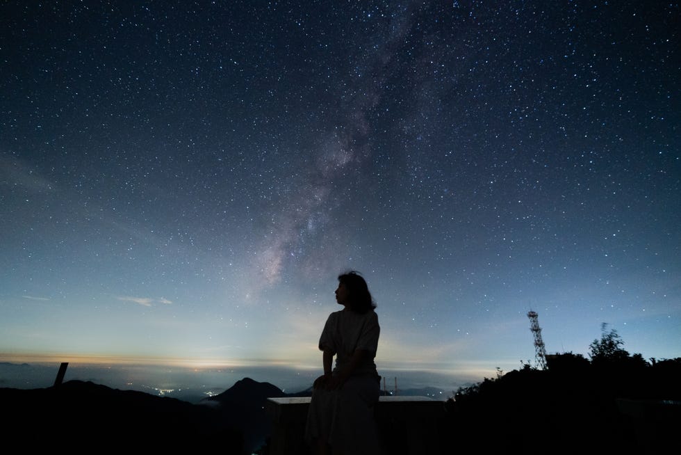 silhouette people against star field