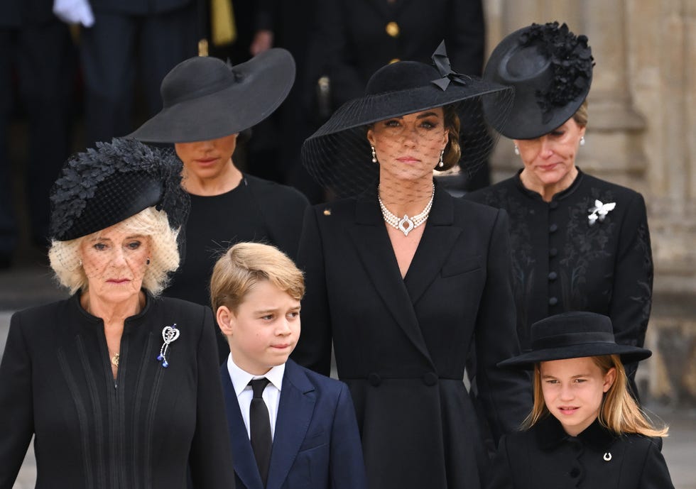 london, england september 19: (l r) camilla, queen consort, meghan, duchess of sussex, prince george of wales, catherine, princess of wales, princess charlotte of wales and sophie, countess of wessex during the state funeral of queen elizabeth ii at westminster abbey on september 19, 2022 in london, england. elizabeth alexandra mary windsor was born in bruton street, mayfair, london on 21 april 1926. she married prince philip in 1947 and ascended the throne of the united kingdom and commonwealth on 6 february 1952 after the death of her father, king george vi. queen elizabeth ii died at balmoral castle in scotland on september 8, 2022, and is succeeded by her eldest son, king charles iii. (photo by karwai tang/wireimage)