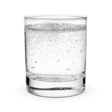 glass of mineral sparkling water isolated on white background