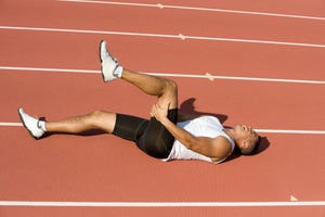 a woman lying on a track