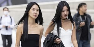 seoul, south korea october 14 guests wear a black top, grey pant with black shoes and a white top, leather pants and shoes outside dongdaemun design plaza at seoul fashion week ss 23 on october 14, 2022 in seoul, south korea photo by matt jelonekwireimage