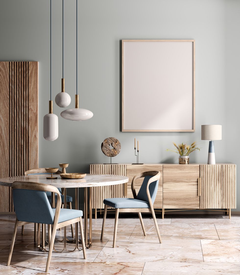 interior design of modern dining room or living room, marble table and chairs wooden sideboard over blue wall home interior with pendant light 3d rendering