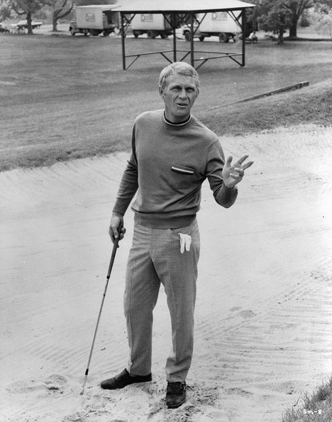 steve mcqueen with a golf club in his hand in scene from the film the thomas crown affair, 1968 photo by united artistgetty images