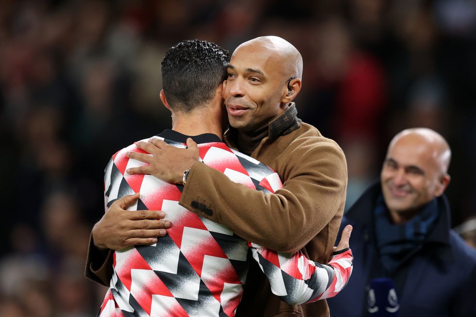 manchester, england october 19 cristiano ronaldo of manchester united interacts with thierry henry prior to the premier league match between manchester united and tottenham hotspur at old trafford on october 19, 2022 in manchester, england photo by alex pantlinggetty images