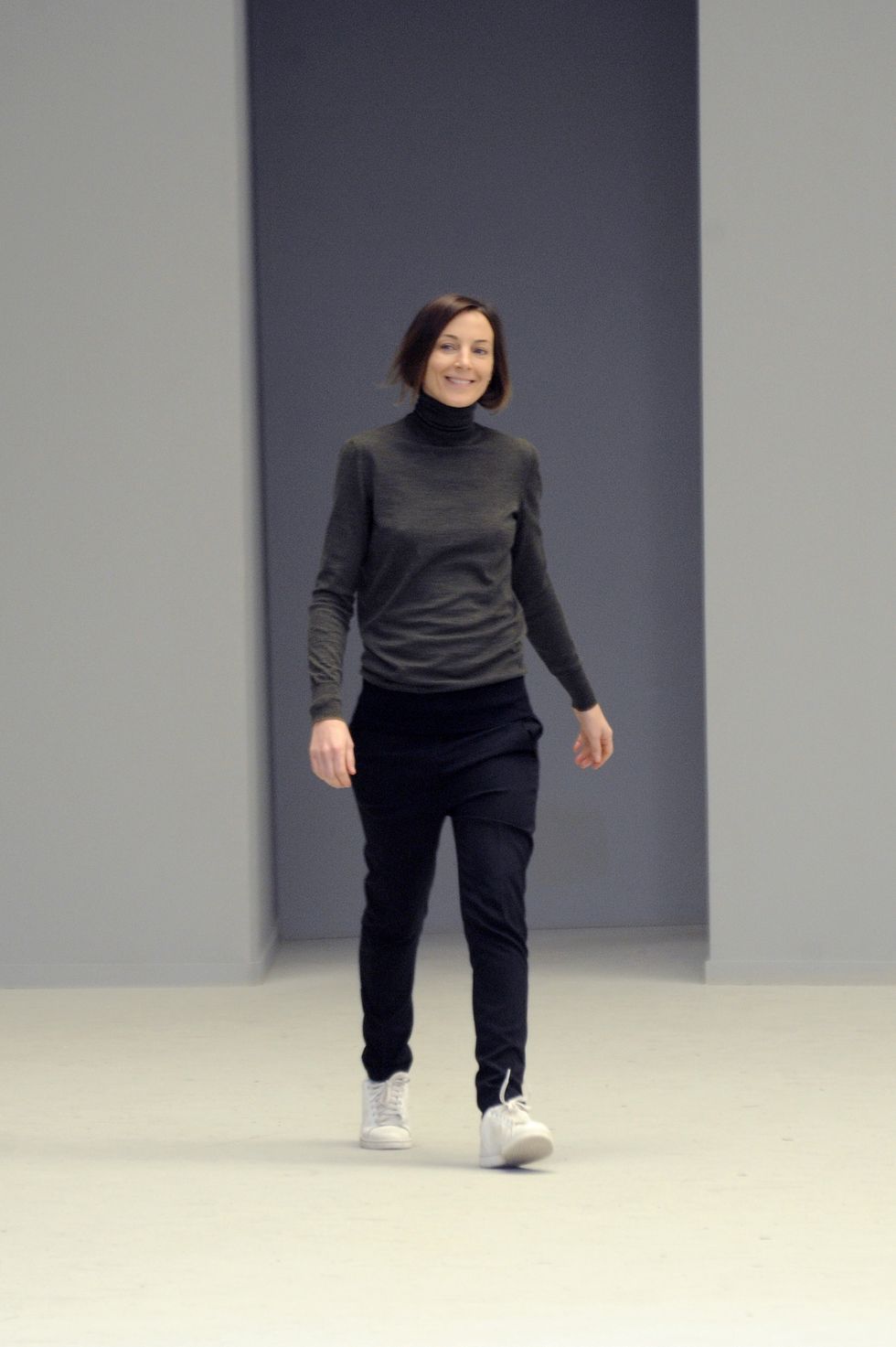 designer phoebe philo on the runway after her celine fall 2011 show