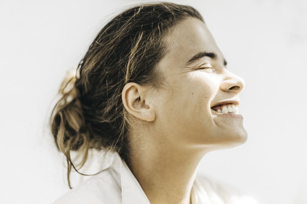 healthy young woman laughing against the sun physical and mental health balance and wellbeing, universal illustration for lifestyle concepts
