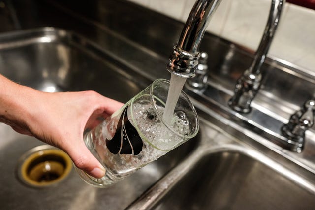 faucet filling a water glass