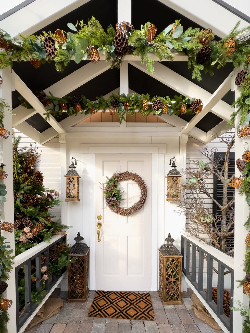 A house with its front door decorated with a wreath in December for the Christmas holidays