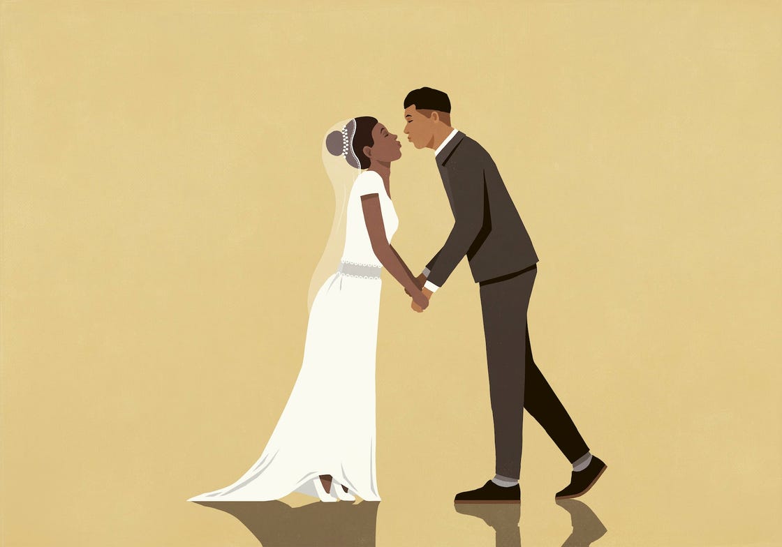 A couple exchanging affection in a wedding setting