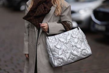 berlin, germany november 10 sonia lyson seen wearing a milk white grey oversized coat, a gobi cashmere grey knit sweater, a louis vuitton monogram scarf and a louis vuitton on the go gm silver puffer bag on november 10, 2022 in berlin, germany photo by jeremy moellergetty images