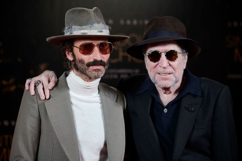 two men wearing hats and sunglasses
