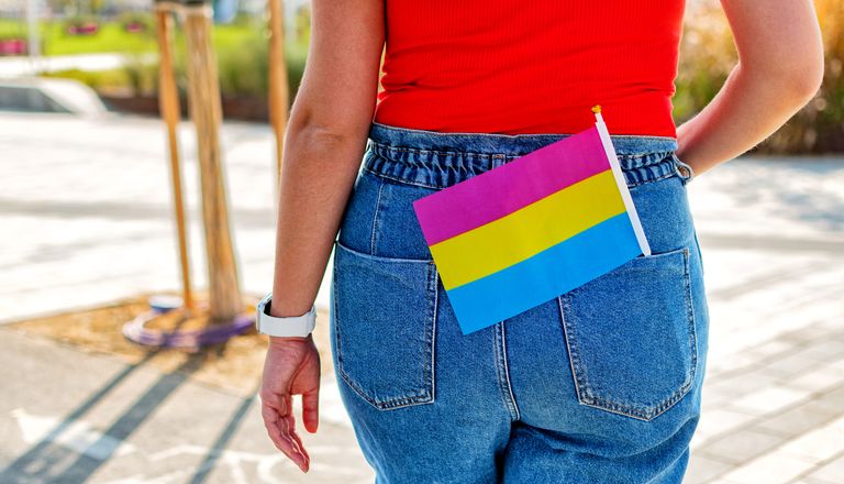 a small lgbt pansexual flag in jeans pocket