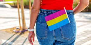 a small lgbt pansexual flag in jeans pocket
