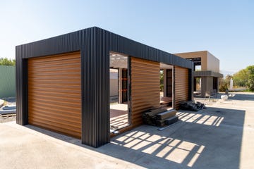 newly built metal framed building with siding construction of a new tiny house selective focus