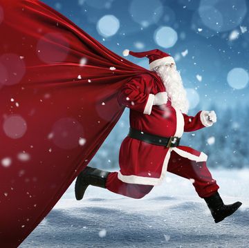 santa claus on the run to delivery christmas gifts with copy space