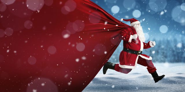 santa claus on the run to delivery christmas gifts with copy space