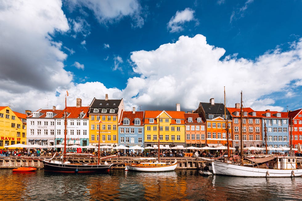 multicolored vibrant houses along nyhavn harbor on a sunny day, copenhagen, denmark