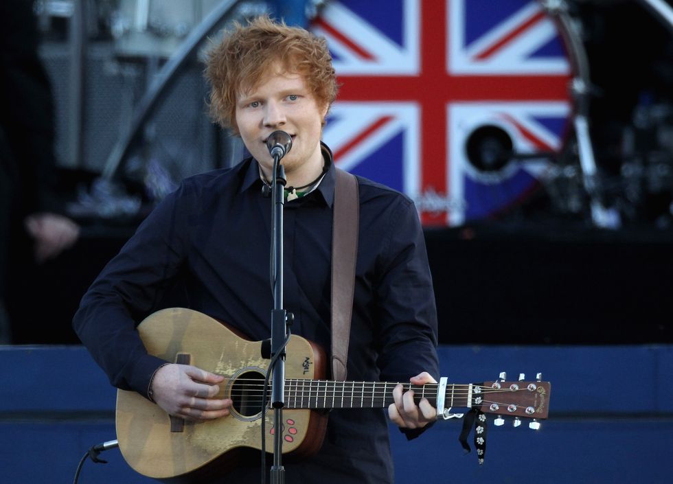 london, england   june 04  singer ed sheeran performs on stage during the diamond jubilee concert at buckingham palace on june 4, 2012 in london, england for only the second time in its history the uk celebrates the diamond jubilee of a monarch her majesty queen elizabeth ii celebrates the 60th anniversary of her ascension to the throne thousands of well wishers from around the world have flocked to london to witness the spectacle of the weekend’s celebrations  photo by dan kitwoodgetty images