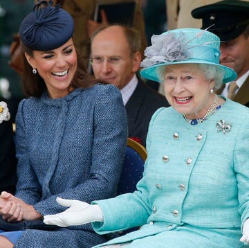 Queen Elizabeth II and The Duke And Duchess Of Cambridge Visit The East Midlands nottingham, england june 13: catherine, duchess of cambridge and queen elizabeth ii watch part of a childrens sports event while visiting vernon park during a diamond jubilee visit to nottingham on june 13, 2012 in nottingham, england. (photo by phil noble wpa pool/getty images)
