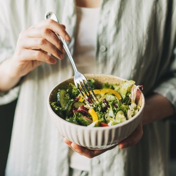 woman holding bowl with products for heart healthy diet, closeup