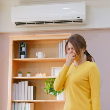 poor indoor air quality asian woman annoyed at bad indoor air quality