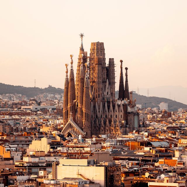 barcelona skyline with sagrada familia at sunset, catalonia, spain