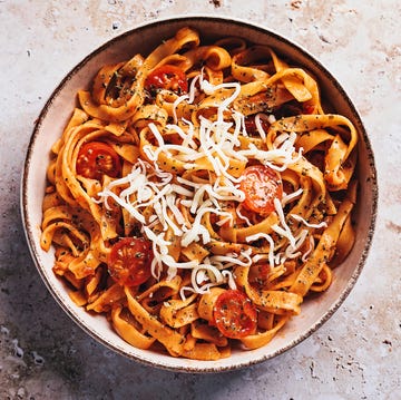 Tagliatelle with tomato sauce on stone background flat lay of tagliatelle with tomato sauce on stone texture background