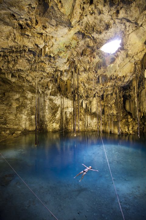 tourist bathing in cenote