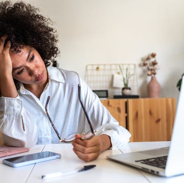 young african american woman feeling exhausted and depressed sitting in front of laptop work burnout syndrome mental health concept