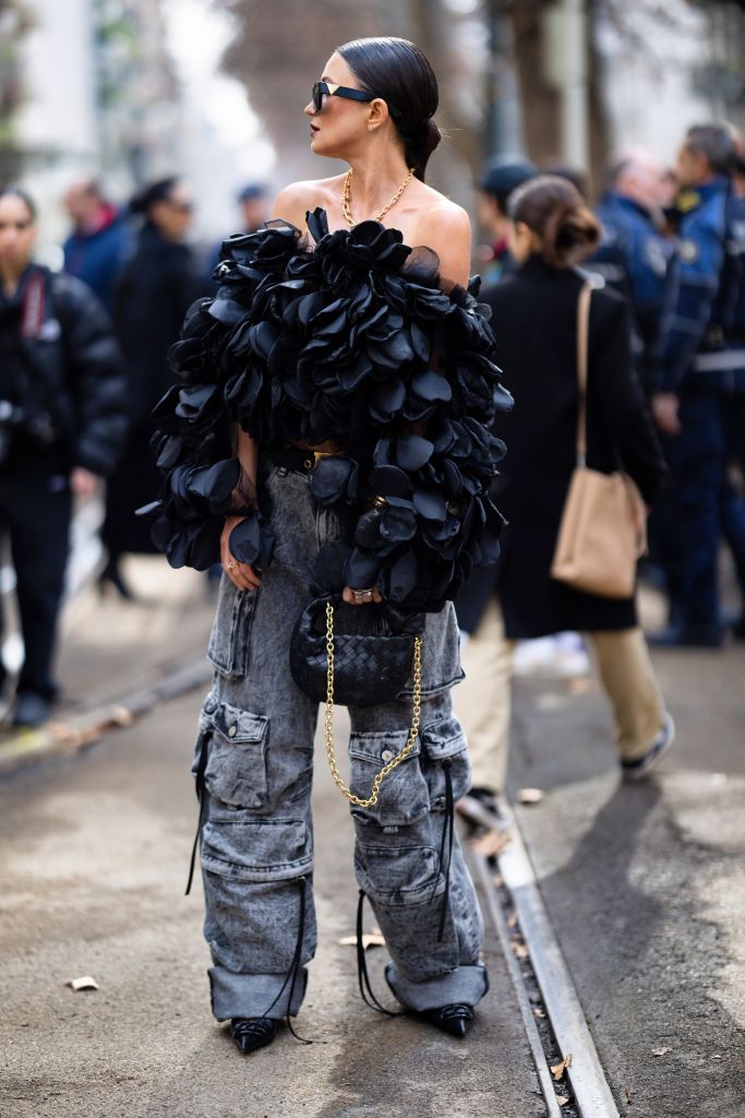milan, italy february 25 a guest is seen wearing cargo denim pants and a 3d tulle off the shoulder top outside the dolce gabbana show during the milan fashion week womenswear fallwinter 20232024 on february 25, 2023 in milan, italy photo by valentina frugiuelegetty images