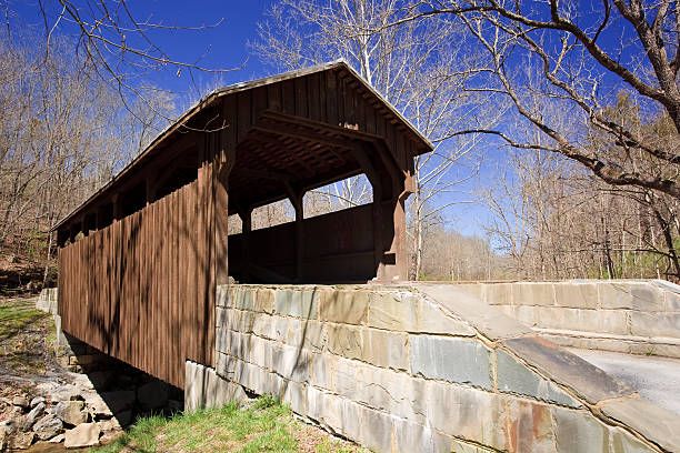 this historic covered bridge c 1884 provided access to the ss herns mill and is one of only two covered bridges remaining in greenbrier county, west virginia  the bridge is 54 feet long and spans milligans creek about four miles from downtown lewisburg