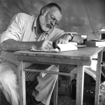 american writer ernest hemingway 1899 1961 working at a portable table while on a big game hunt in kenya, september 1952 photo by earl theisengetty images 