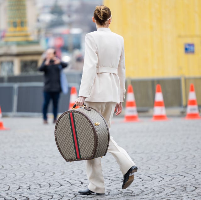 paris, france march 04 a guest wears oversized gucci hand bag outside vivienne westwood during paris fashion week womenswear fall winter 2023 2024 day six on march 04, 2023 in paris, france photo by christian vieriggetty images