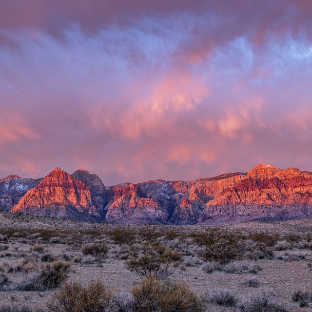 beautiful early morning light bounces off the mountains of red rock canyon in las vegas, hence the name sake