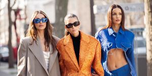paris, france march 02 mari fonseca is seen wearing hwite pants, white top, grey coat and blue sunglasses, and fer millan delaroiere is seen wearing black boots, black mini dress and orange glitter coat, and sofia resing is seen wearing a blue denim suit outside off white show during paris fashion week womenswear fall winter 2023 2024, on march 02, 2023 in paris, france photo by raimonda kulikauskienegetty images