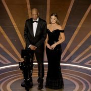 hollywood, california march 12 l r morgan freeman and margot robbie speak onstage during the 95th annual academy awards at dolby theatre on march 12, 2023 in hollywood, california photo by kevin wintergetty images
