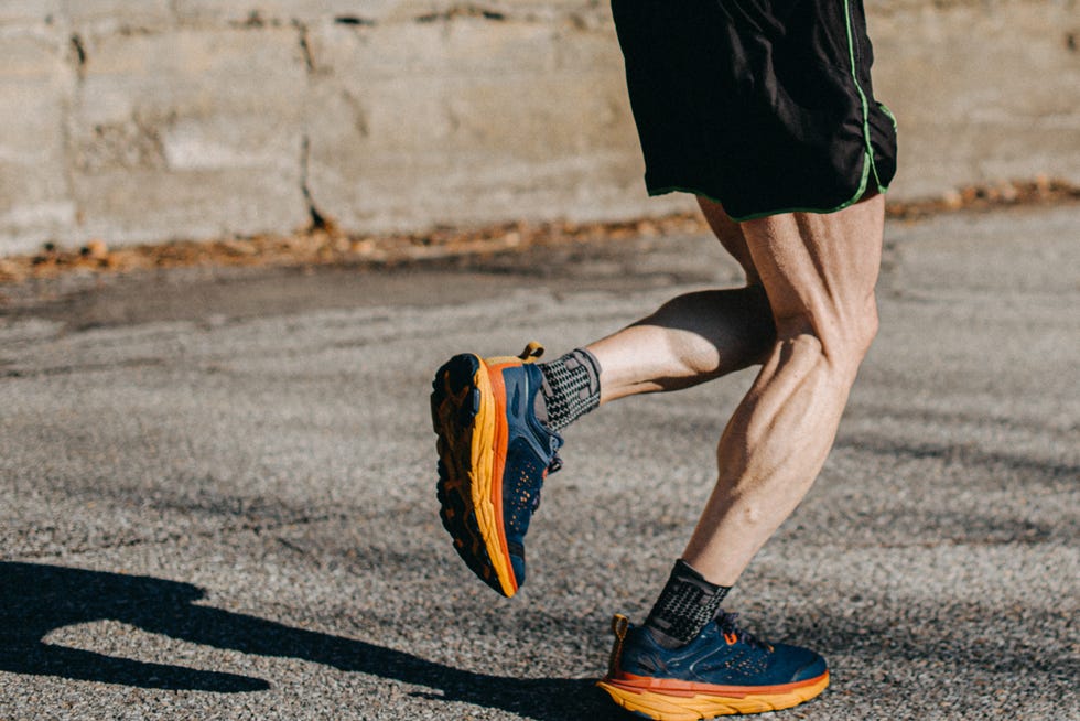 a man running with a shoe
