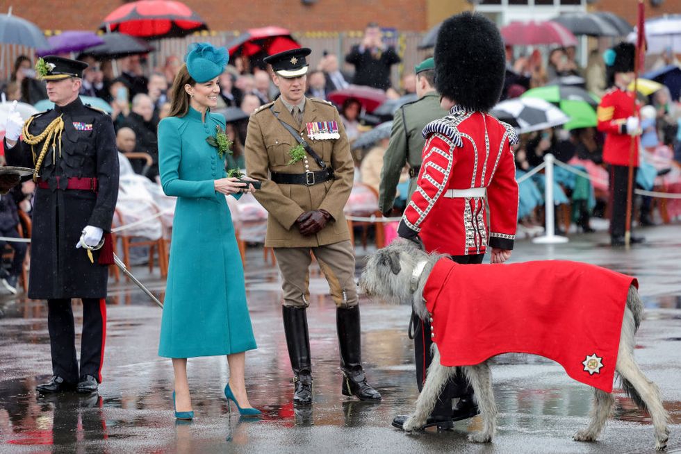 aldershot, england march 17 catherine, princess of wales meets with irish wolf hound turlough mor aka seamus, regimental mascot of the irish guards during the st patricks day parade at mons barracks on march 17, 2023 in aldershot, england catherine, princess of wales attends the parade for the first time as colonel of the regiment succeeding the prince of wales, the outgoing colonel photo by chris jackson wpa poolgetty images