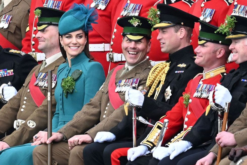 aldershot, england march 17 prince william, prince of wales, catherine, princess of wales and members of the 1st battalion irish guards pose for photographers during the st patricks day parade at mons barracks on march 17, 2023 in aldershot, england catherine, princess of wales attends the parade for the first time as colonel of the regiment succeeding the prince of wales, the outgoing colonel photo by samir husseinwireimage
