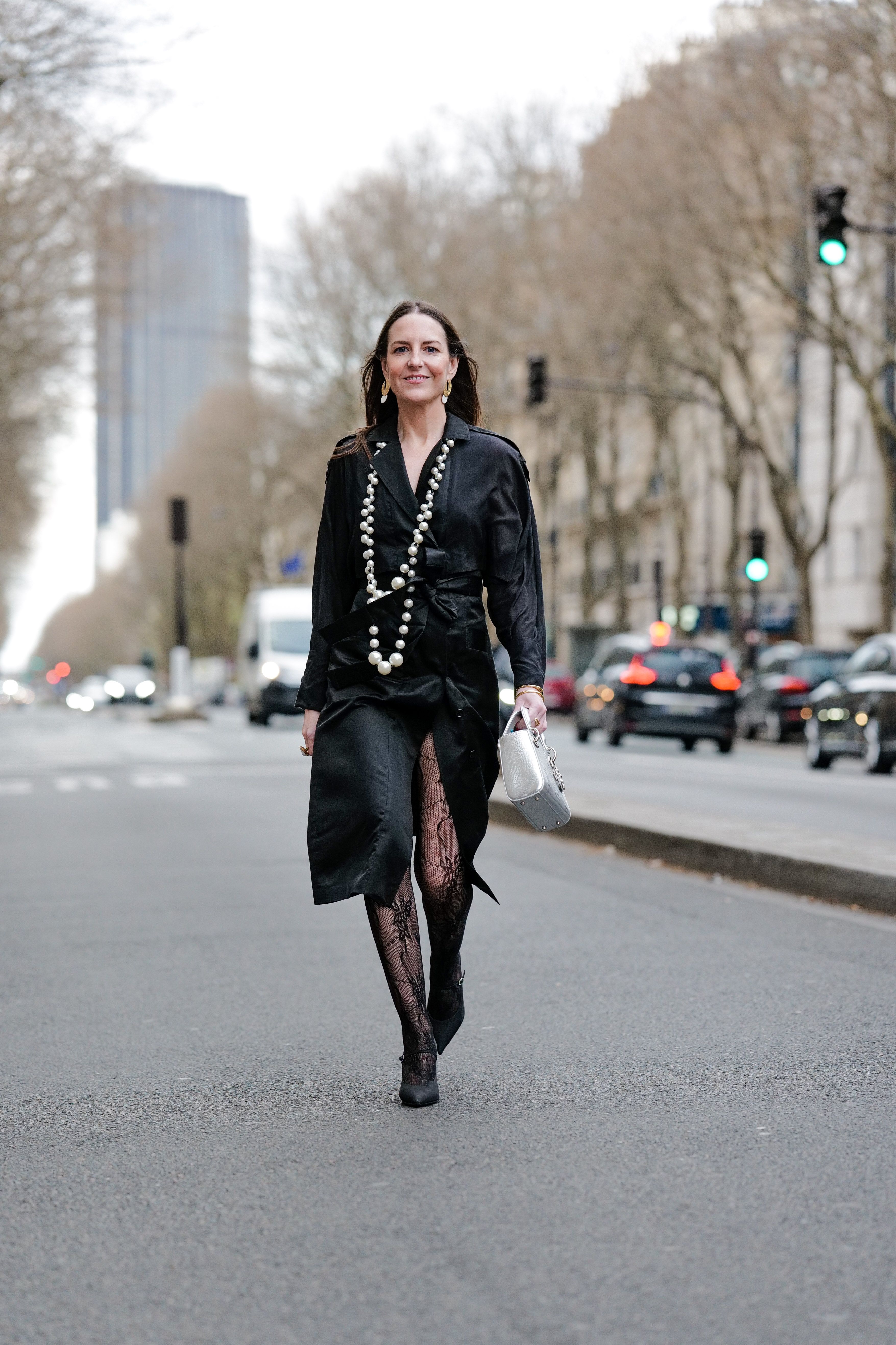 11 Fashionable Ways to Style Black Tights With a Dress According to Fashion Editors