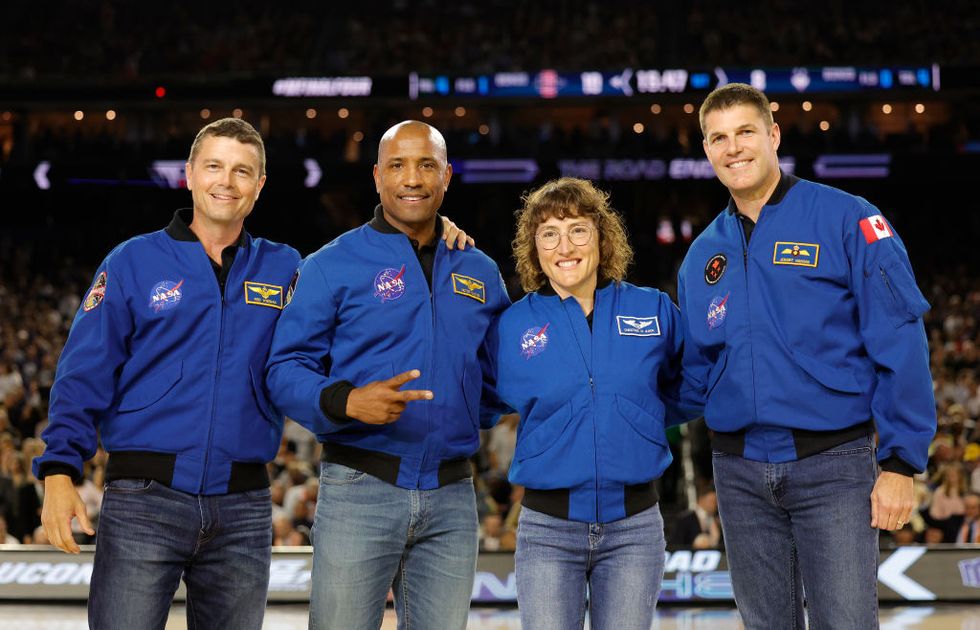 houston, texas april 03 l r astronauts jeremy hansen, christina koch, victor glover, and reid wiseman on the court prior to the game between the san diego state aztecs and connecticut huskies during the ncaa mens basketball tournament national championship game at nrg stadium on april 03, 2023 in houston, texas photo by carmen mandatogetty images