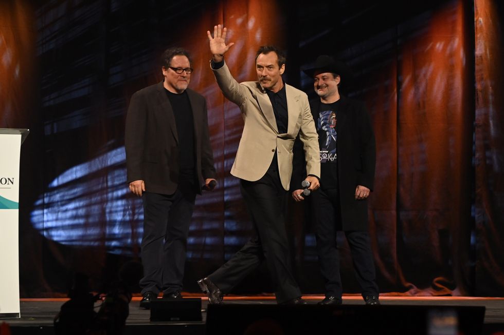 london, england april 07 jon favreau, jude law, and dave filoni onstage during the studio panel for skeleton crew at the star wars celebration 2023 in london at excel on april 07, 2023 in london, england photo by kate greengetty images for disney