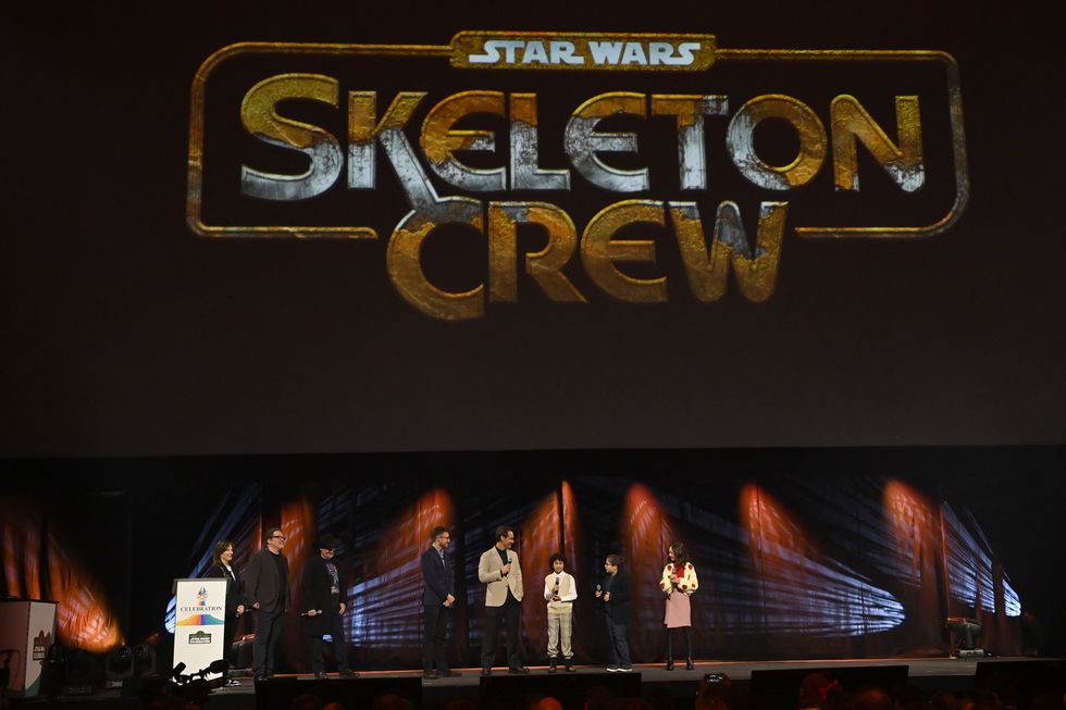 london, england april 07 l r kathleen kennedy, jon favreau, dave filoni, presenter ali plumb, jude law, ravi cabot conyers, robert timothy smith and kyrianna kratter onstage during the studio panel for skeleton crew at the star wars celebration 2023 in london at excel on april 07, 2023 in london, england photo by kate greengetty images for disney