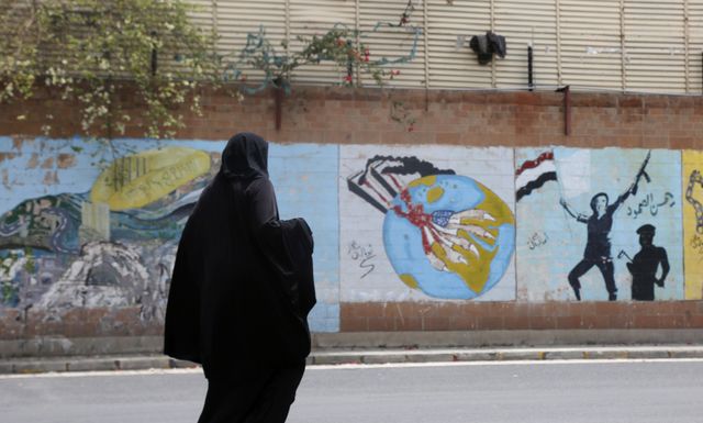 sanaa, yemen april 11 a yemeni woman walks past the closed embassy of saudi arabia, with its wall colored with anti coalition drawings drawn by activists previously, on april 11, 2023 in sanaa, yemen the united nations envoy for yemen said on tuesday that he was encouraged by the depth and seriousness of talks between stakeholders in yemen, including in a visit by saudi and omani delegations to sanaa saudi and omani envoys are holding peace talks with houthi officials in sanaa this week as riyadh seeks a permanent ceasefire to end its military involvement in the countrys long running war the united nations is not directly involved in sanaas negotiations photo by mohammed hamoudgetty images
