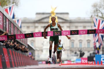 a runner crossing the finish line in a marathon event
