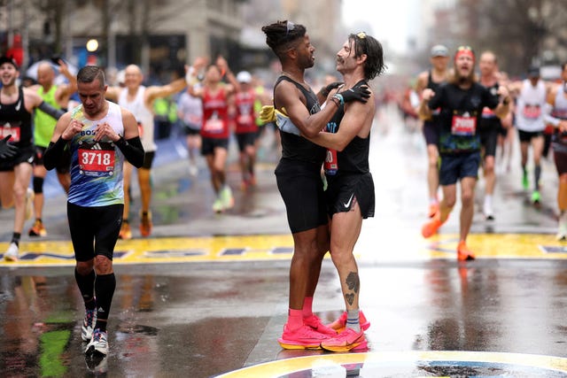 boston, massachusetts april 17 knox robinson l and jordan phelps r celebrate after crossing the finish line during the 127th boston marathon on april 17, 2023 in boston, massachusetts photo by maddie meyergetty images